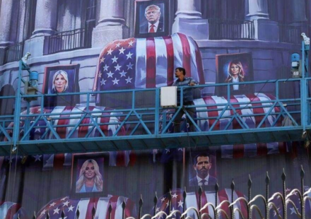 A billboard in Tehran depicted Donald Trump and members of his family above coffins bearing the American flag (@Daily_Express/X)